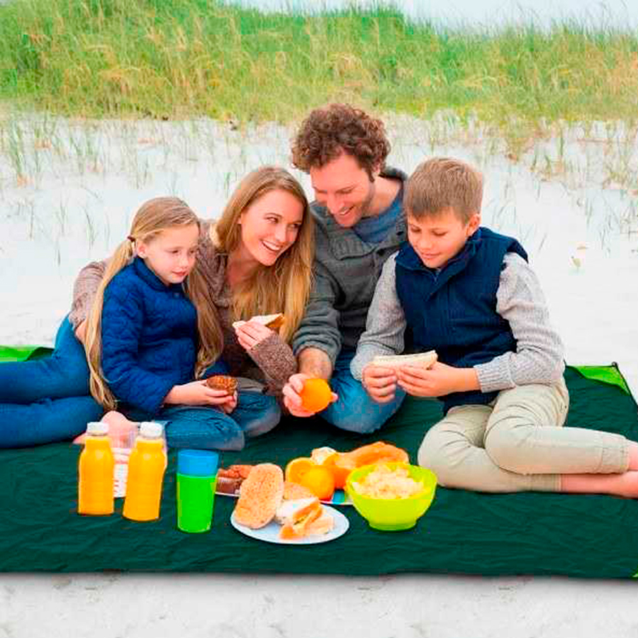 Family sitting on footprint(tarp) by Kamui Outdoors