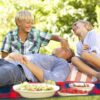 Father and two kids sitting on Kamui Blanket Red and Blue