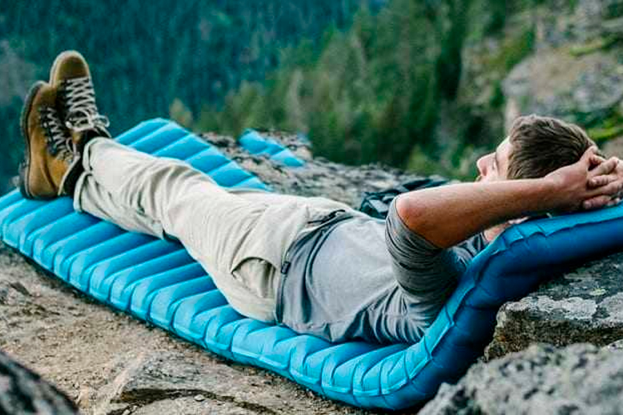 Man Laying On Sleeping Pad