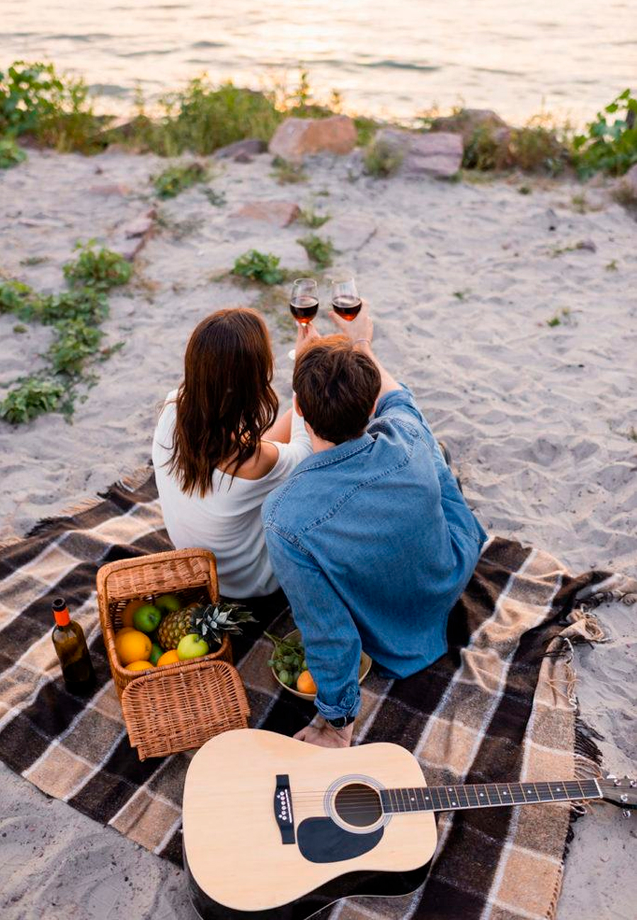 couple on picnic with guitar