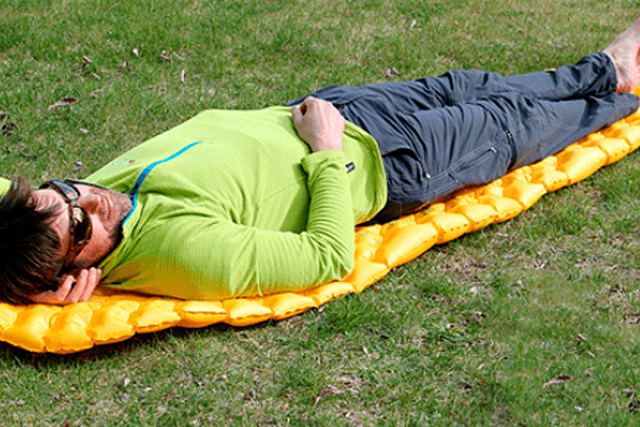 Man resting on sleeping pad