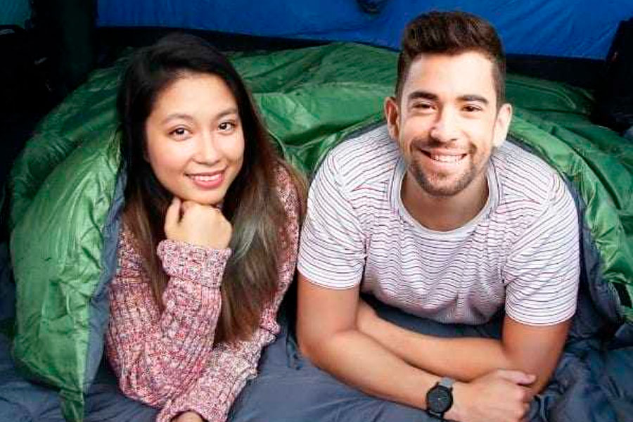 Two people in a tent in a sleeping bag
