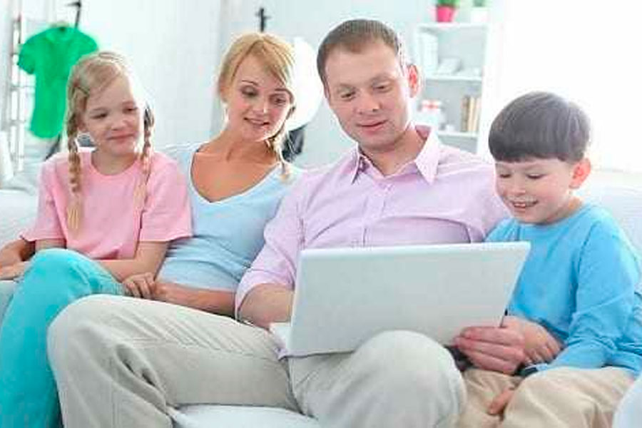 Family With Two Kids Surfing Internet