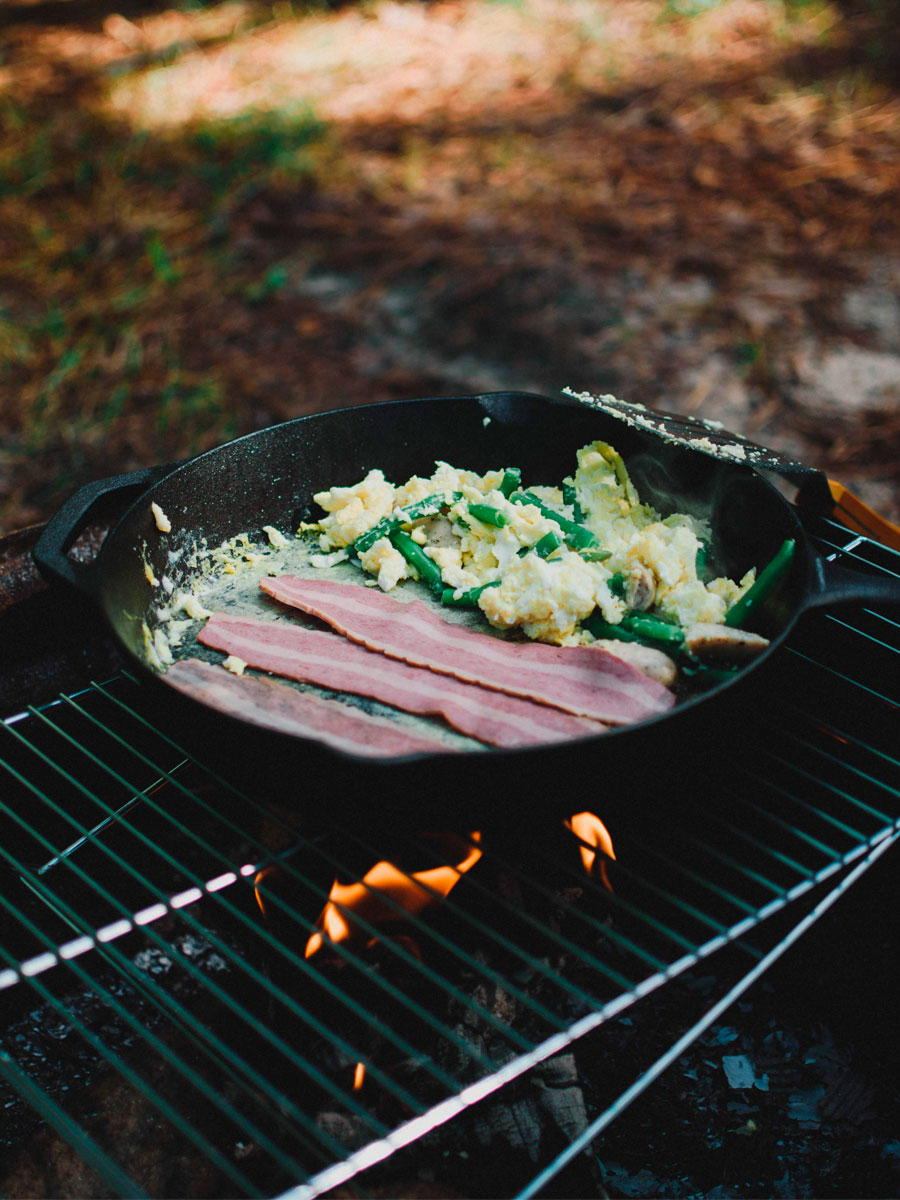 bacon and eggs on campfire