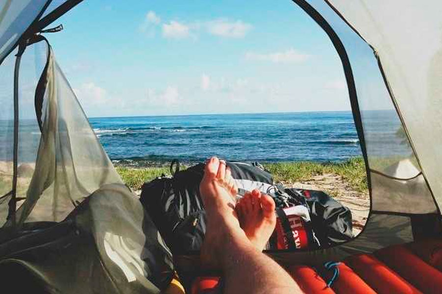 View from the inside of a tent on a beach