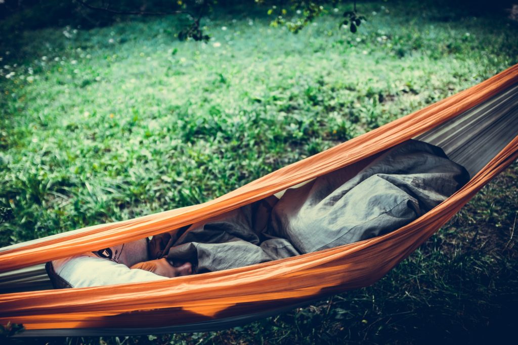 child sleeping in hammock