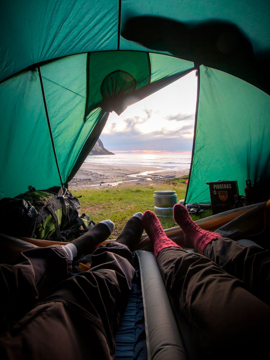 couple with socks camping in tent