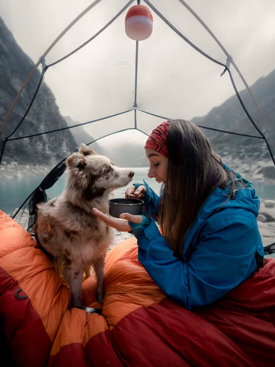 girl and dog in tent