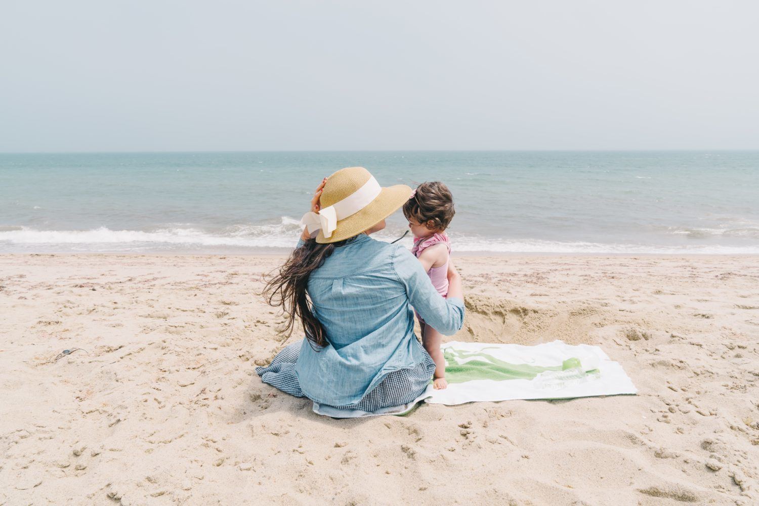 mother and child on beach