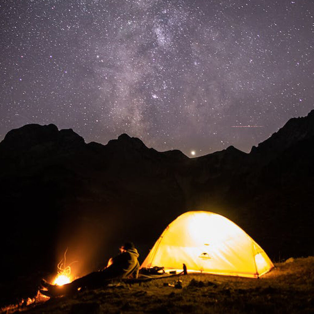 a well-lit tent on a cold night