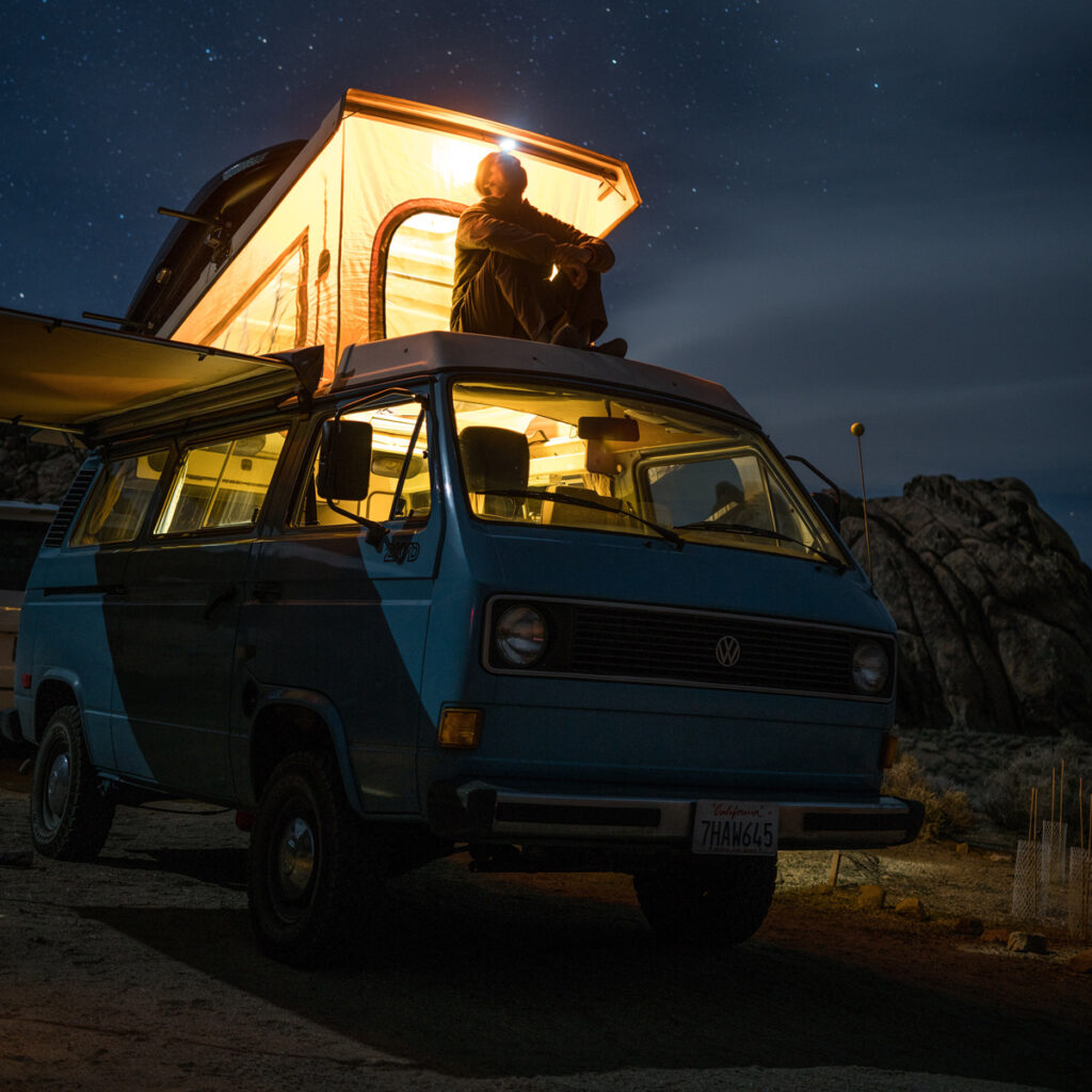 A man seated on a van