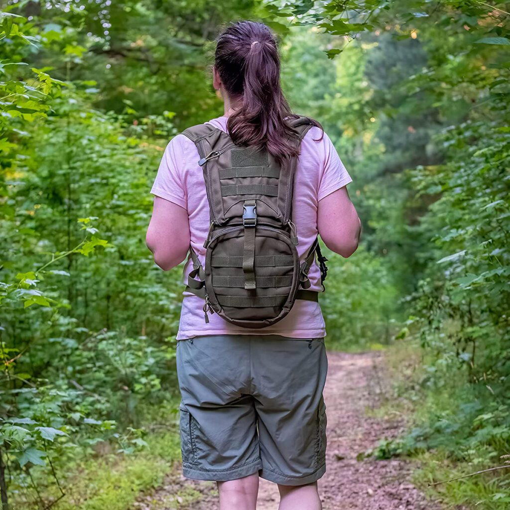 A-woman-carrying-a-KAMUI-Hydration-Backpack