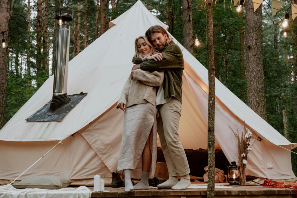 A couple while on a glamping trip