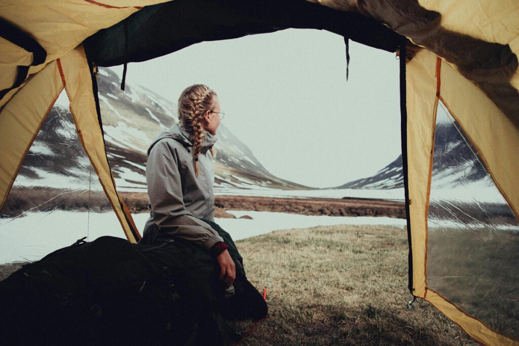 A woman enjoying the view around her campsite
