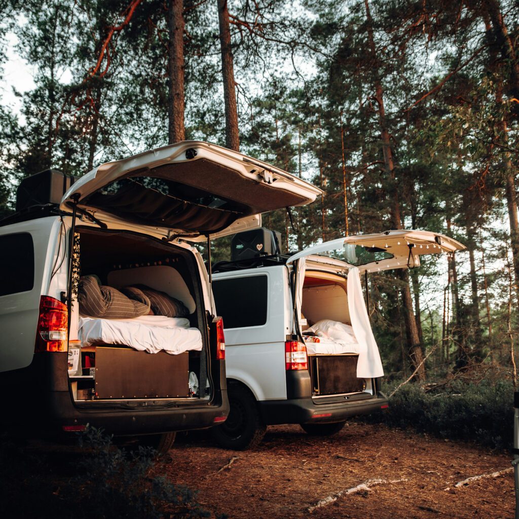 Two vans with sleeping setups